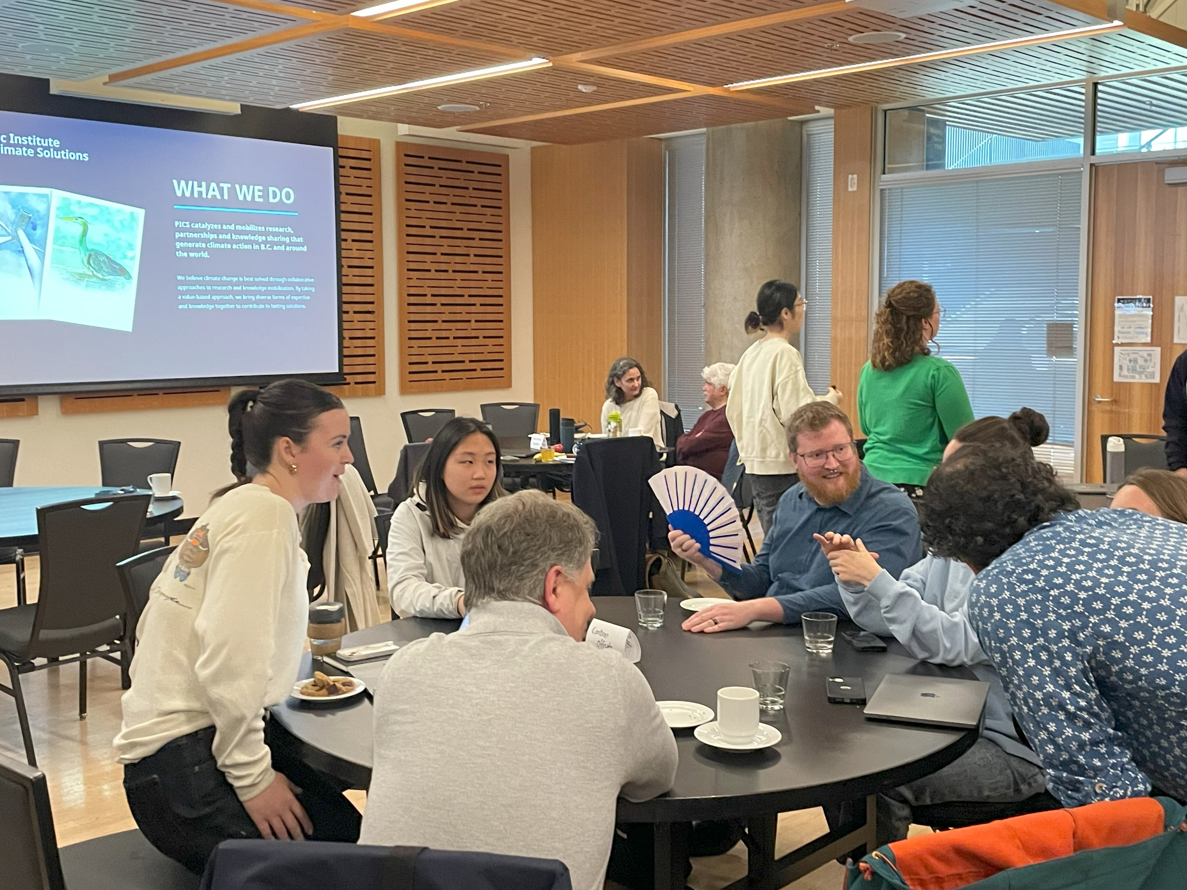 people gather around a table