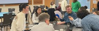 people gather around a table